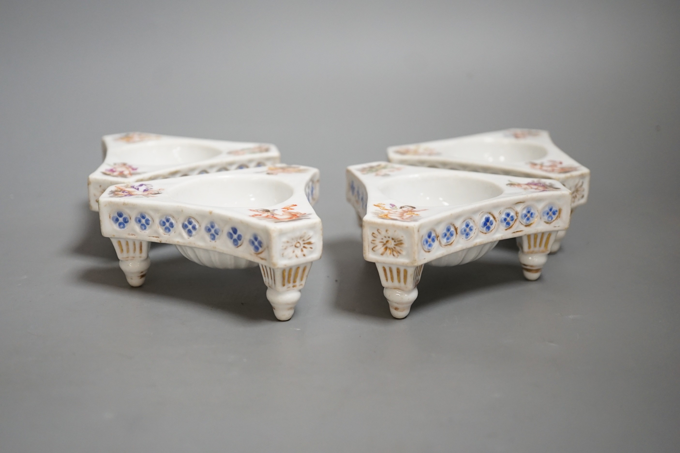 Four late 19th century Dresden porcelain tripod salts, by Helena Wolfsohn, 10cm wide